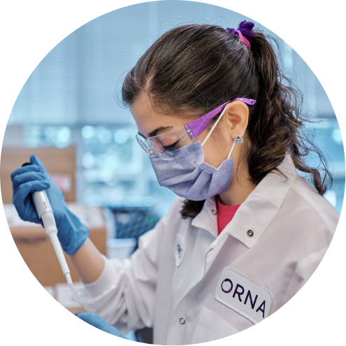 Circular photo of an Orna scientist in a lab as she pipettes into a tube, encircled by an ombre red-yellow paint stroke
